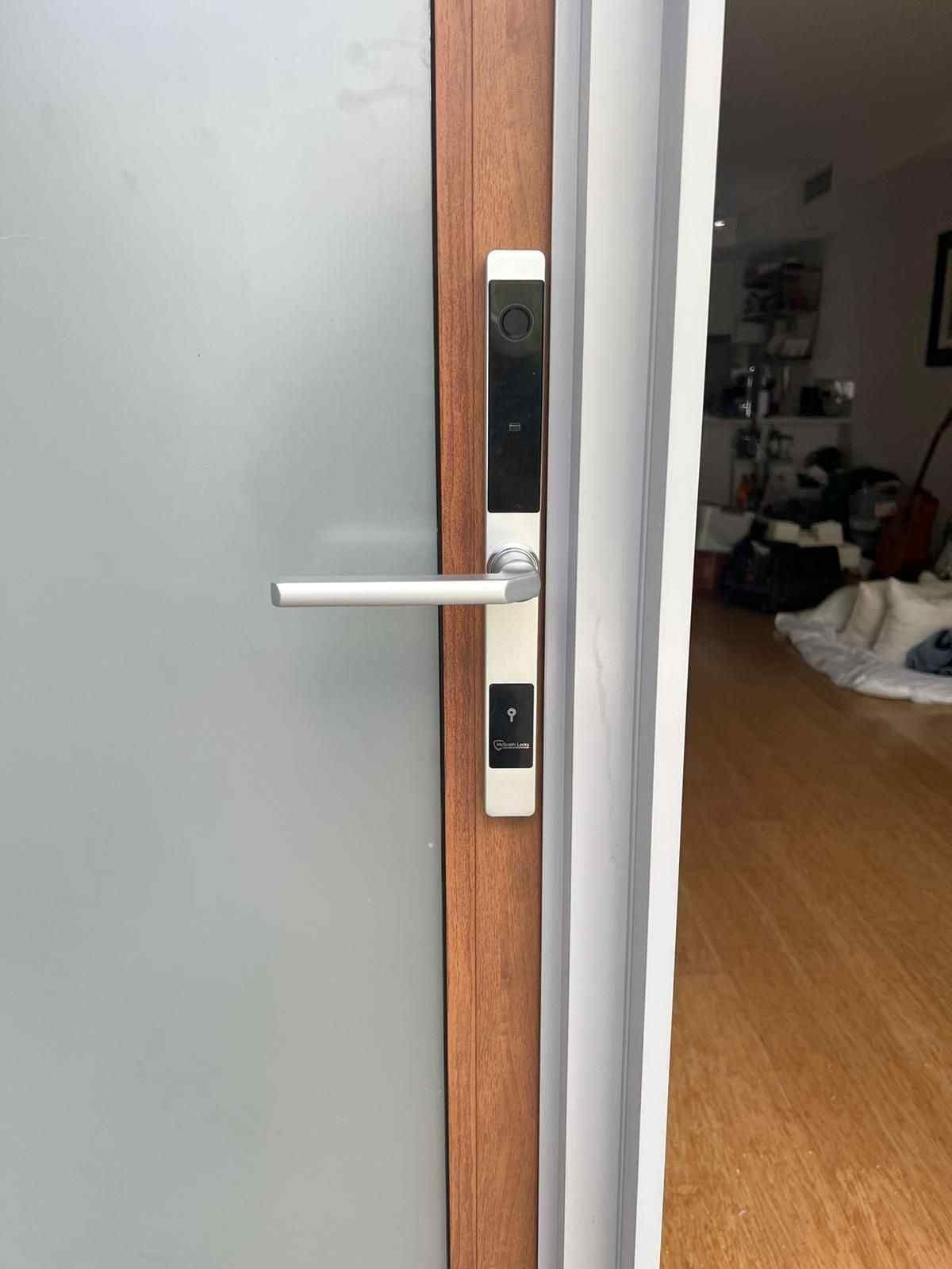 Locksmith checking a residential door lock before providing house lockout pricing